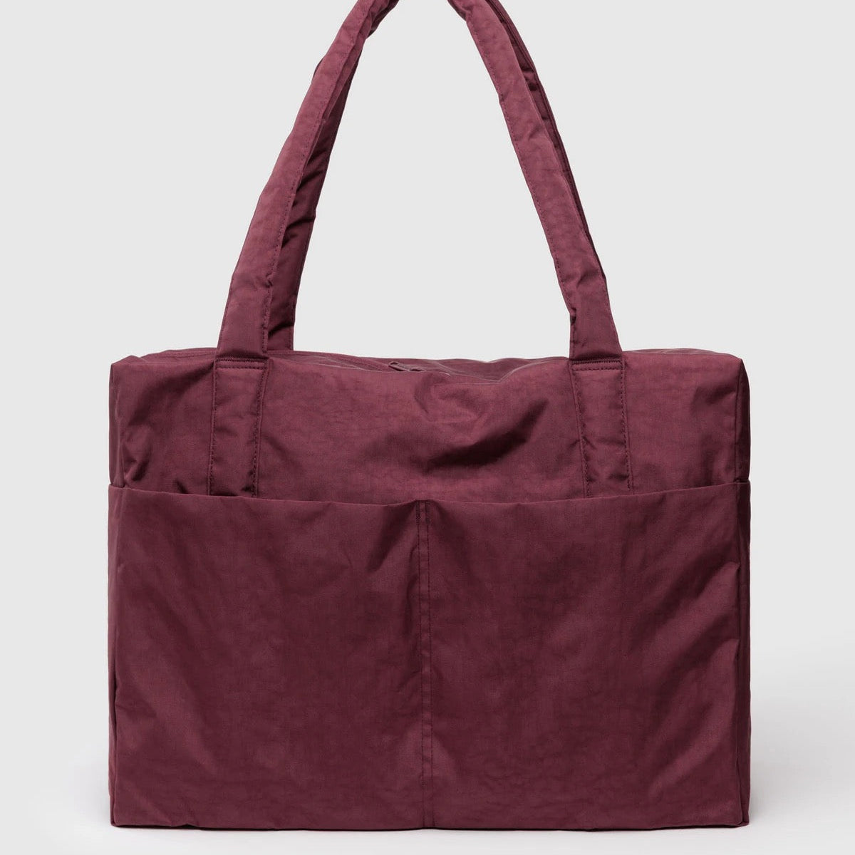 mahogany Baggu cloud carry-on with handles and pockets.
