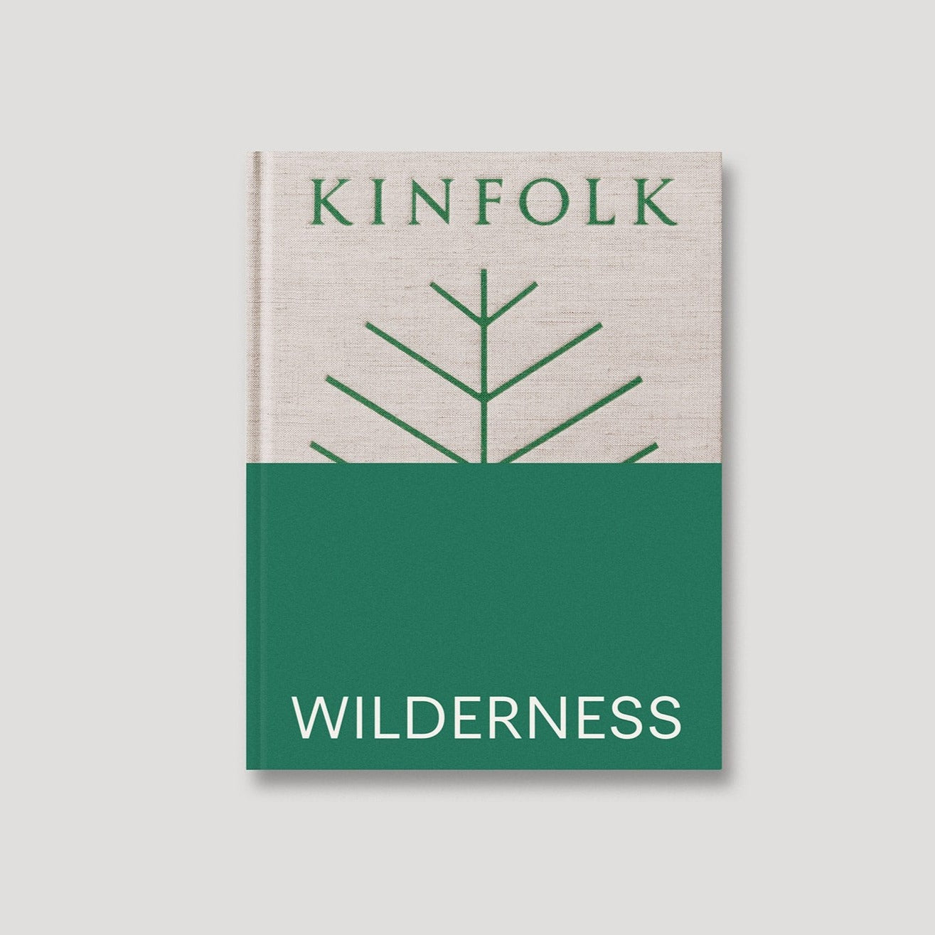 The cover of the book 'Kinfolk Wilderness', featuring a minimalist design with a green and white color scheme and a stylized tree graphic.
